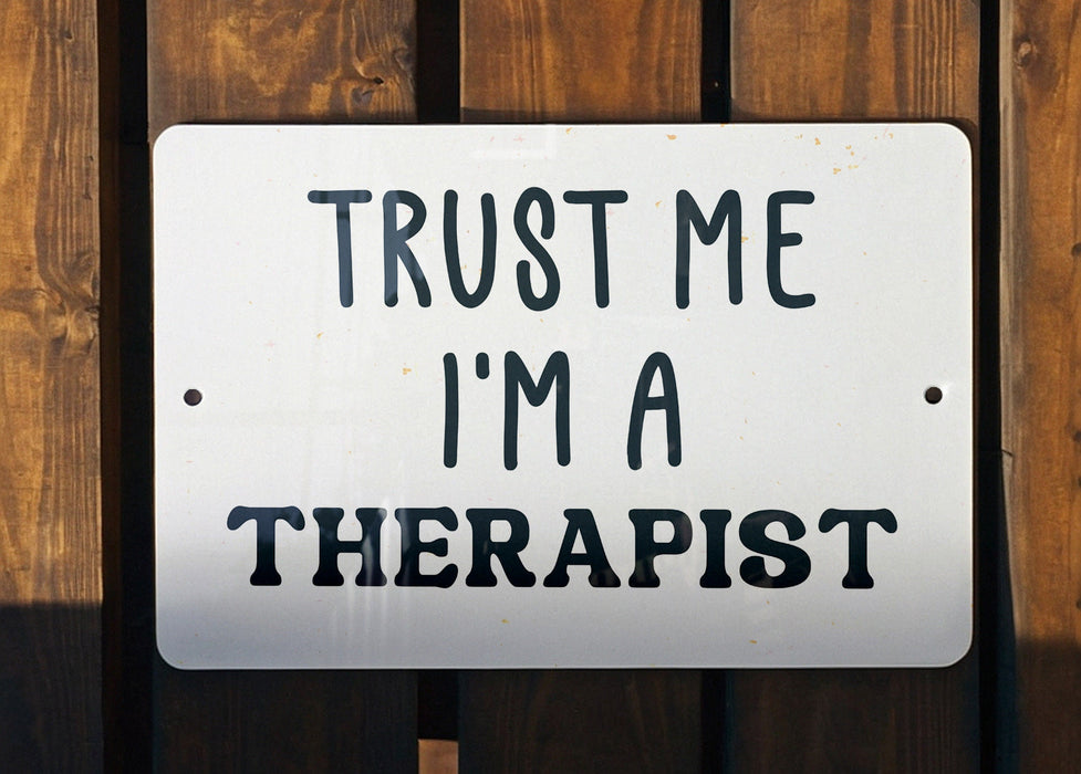a sign that says trust me i'm a therapist