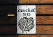 a sign that says crochet nerd on it