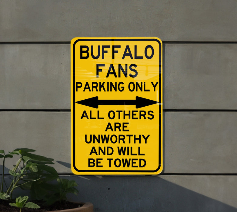 a yellow sign that is on the side of a building