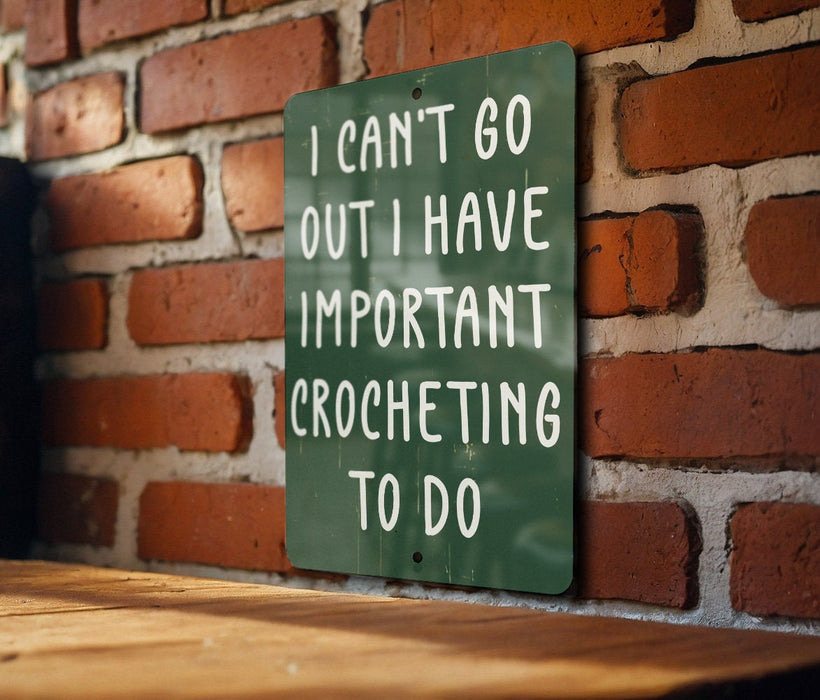 a green sign that says i can't go out i have important croche