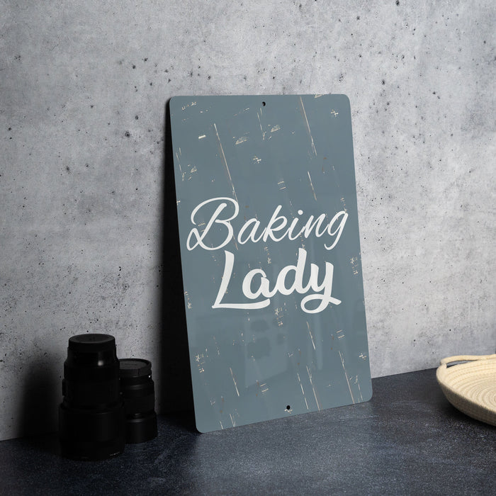 a sign that says baking lady next to a pair of binoculars