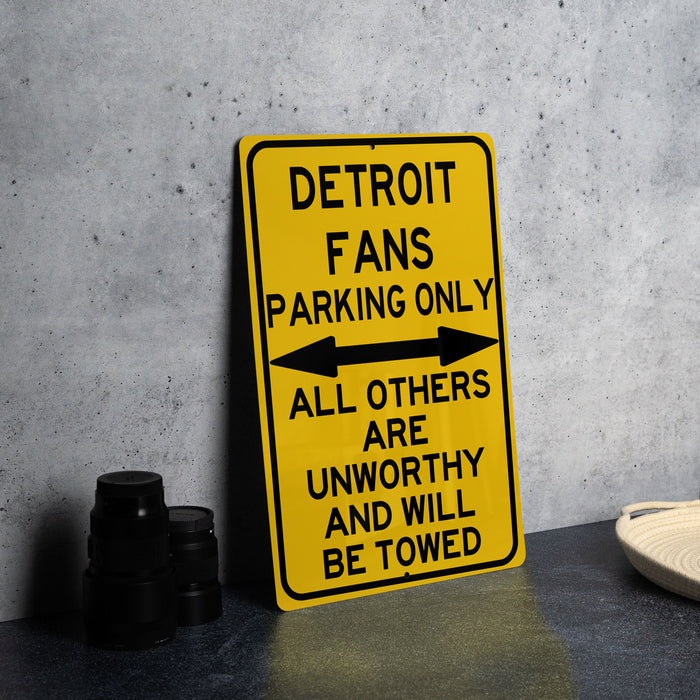 a yellow street sign sitting on top of a table