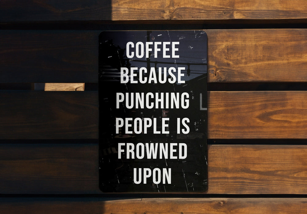 a sign on a wooden bench that says coffee because punching people is frowned upon