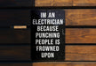 a sign on a wooden bench that says i'm an electrician because punching