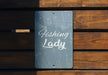 a sign that says fishing lady on it
