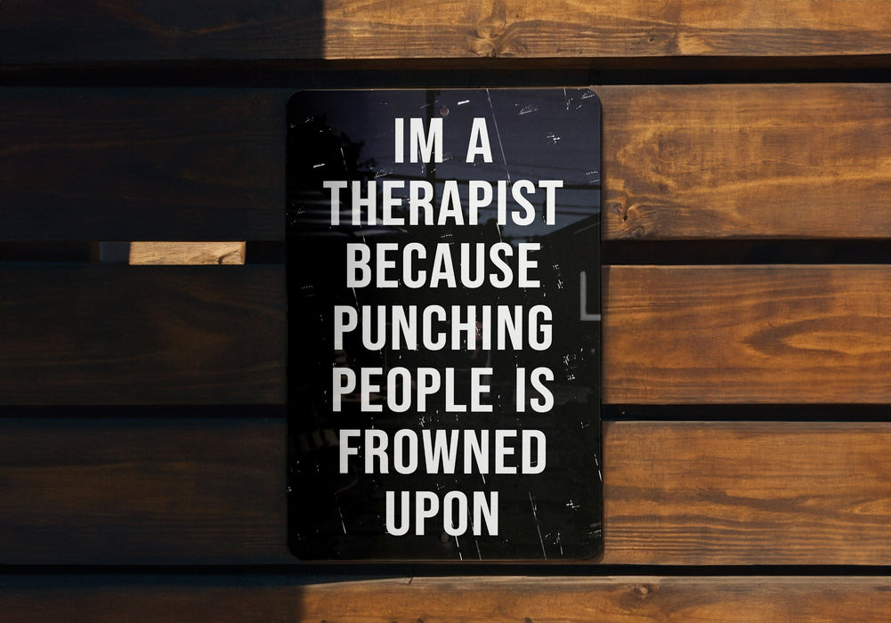 a sign that says i'm a therapist because punching people is