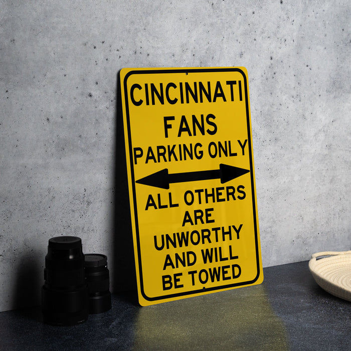 a yellow street sign sitting on top of a table