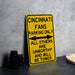 a yellow street sign sitting on top of a table