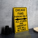 a yellow street sign sitting on top of a table