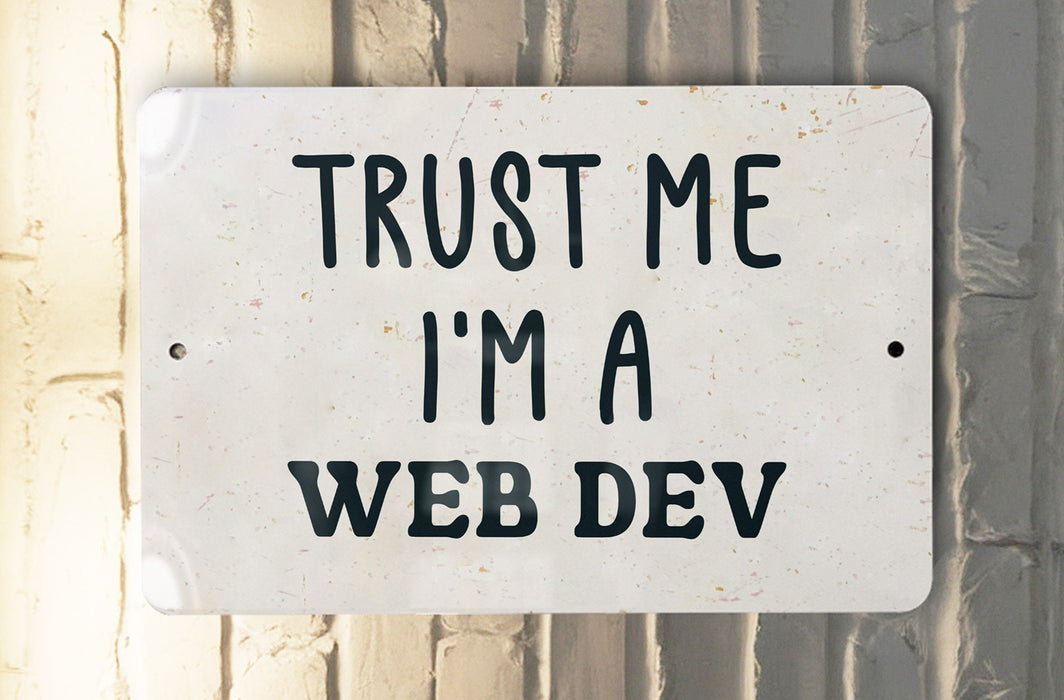 a white sign that says trust me i'm a web dev