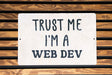 a sign that says trust me i'm a web dev