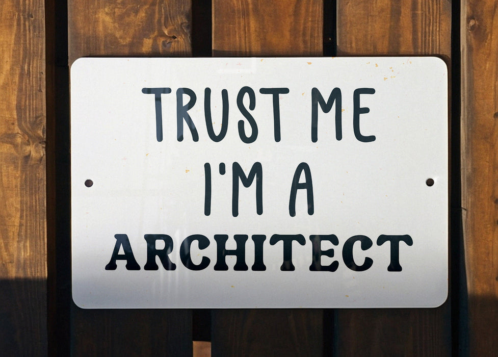 a white sign that says trust me i'm a architecture