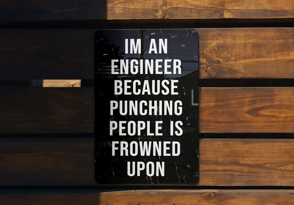 a sign on a wooden bench that says i'm an engineer because punching people
