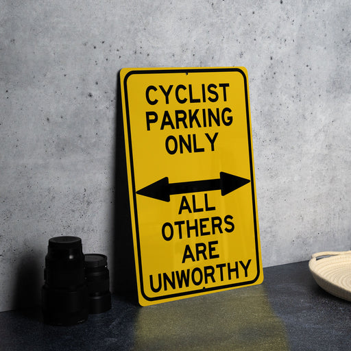 a yellow sign that says cyclist parking only all others are unworthyly