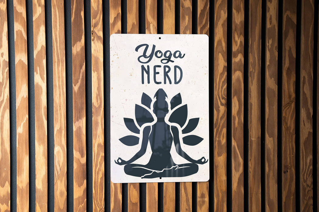 a sign on a wooden wall that says yoga nerd
