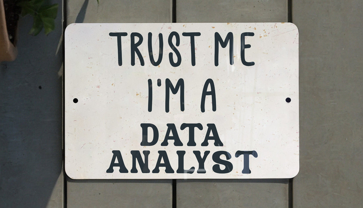 a white sign that says trust me i'm a data analist
