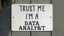 a white sign that says trust me i'm a data analist
