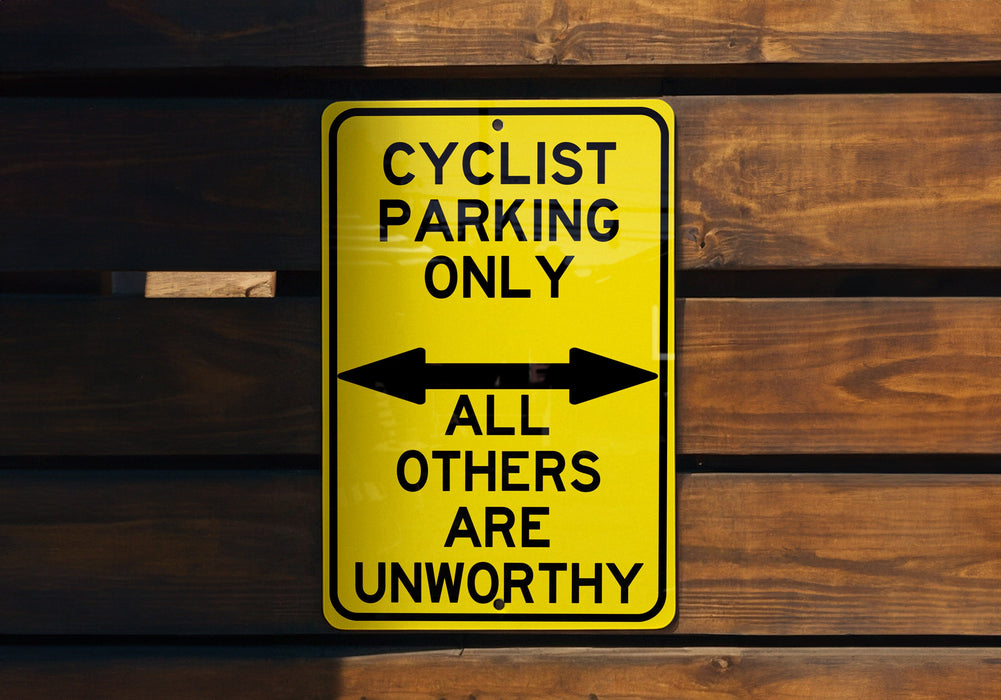 a yellow sign that says cyclist parking only all others are unworthyly