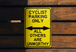 a yellow sign that says cyclist parking only all others are unworthyly