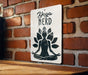 a sign on a brick wall that says yoga nerd