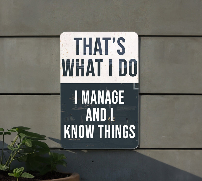 a sign that says that's what i do i manage and i know things