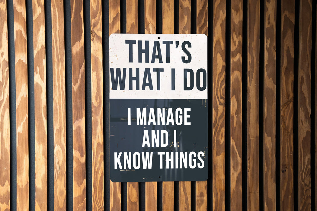 a sign on a wooden wall that says, that's what i do i