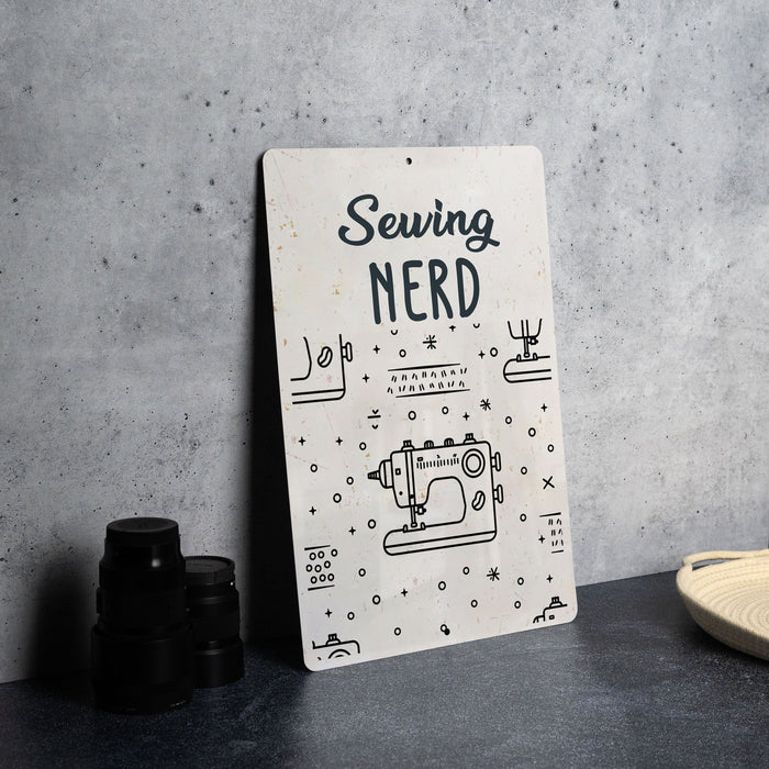 a sign that says sewing nerd next to a pair of binoculars
