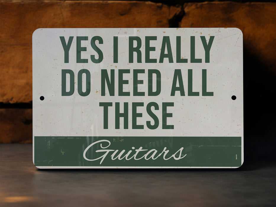 a sign that says, yes i really do need all these guitars