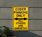 a yellow parking only sign on the side of a building