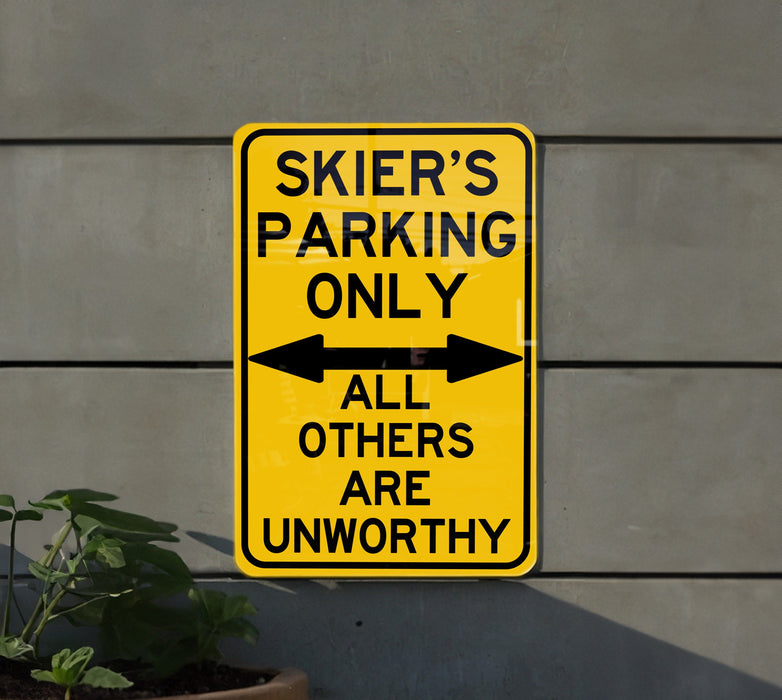 a yellow sign that says skier's parking only all others are unworthyly
