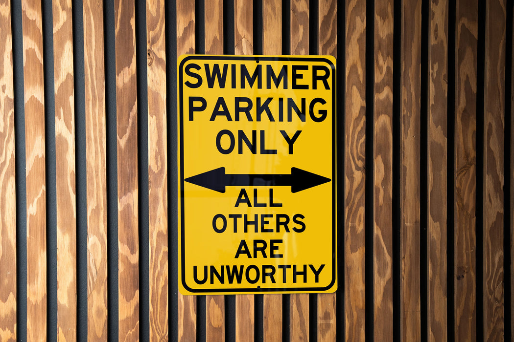 a yellow and black sign on a wooden wall