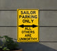 a yellow parking only sign on the side of a building