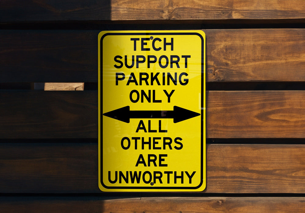 a yellow sign that says tech support parking only all others are unworthyly