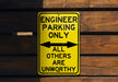 a yellow sign that says engineer parking only all others are unworthyly