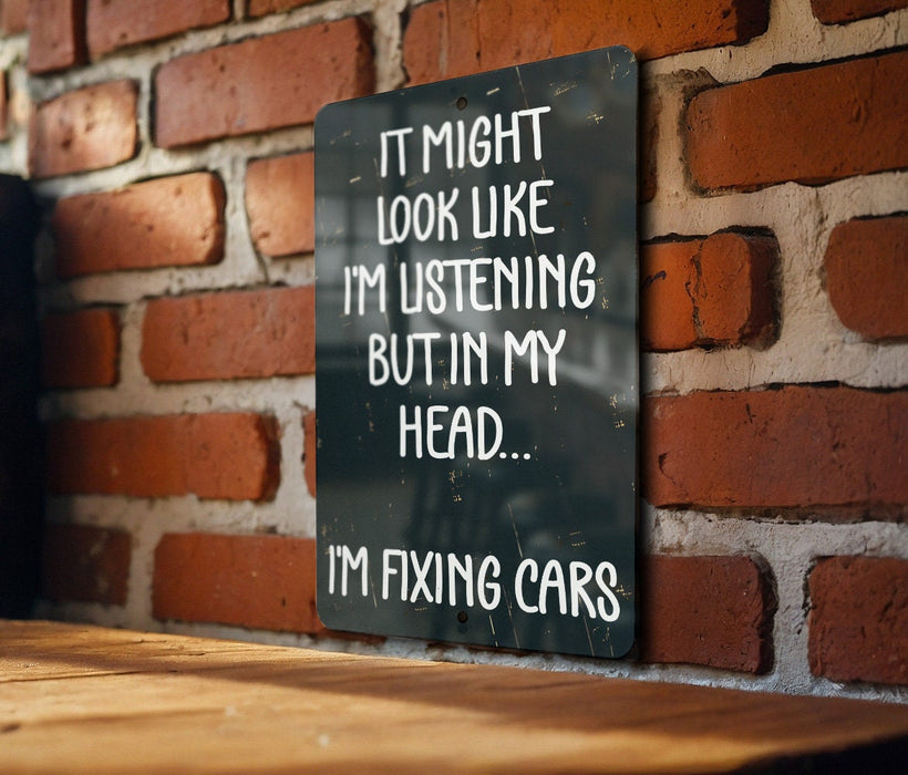 a sign that says it might look like i'm listening but in my head