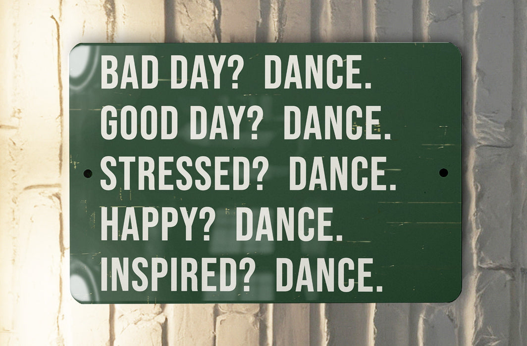 a green sign that says bad day? dance good day? dance stressed?