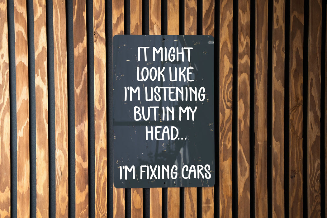 a sign that says it might look like i'm listening but in my head