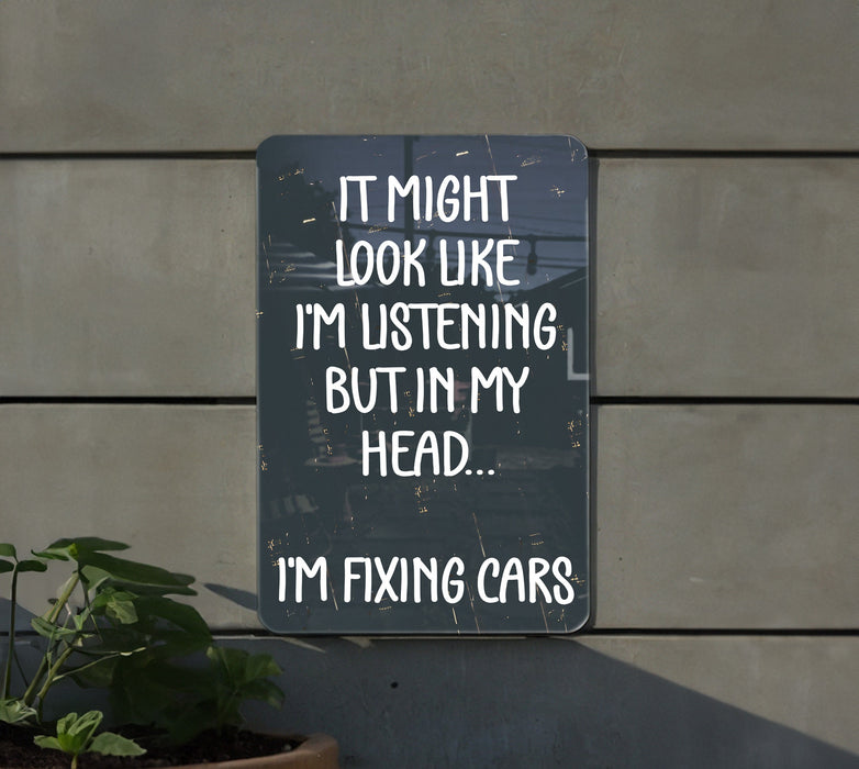 a sign that says it might look like i'm listening but in my head