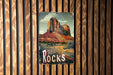 a wooden wall with a sign that says red rocks on it