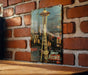 a picture of a space needle on a brick wall
