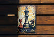 a metal sign with a picture of a chess game on it