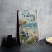 a book sitting on top of a table next to a plate