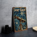 a metal sign with a picture of a telescope on it