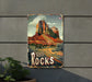 a sign on a wall that says red rocks