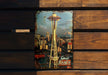 a picture of the space needle on a wooden bench
