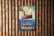 a sign on a wooden wall that says nordic waters