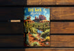 a book sitting on top of a wooden bench