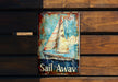 a sail away sign on a wooden wall