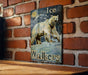 a picture of a polar bear on a brick wall