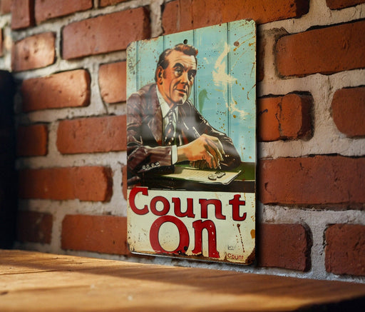 a picture of a man on a sign on a brick wall